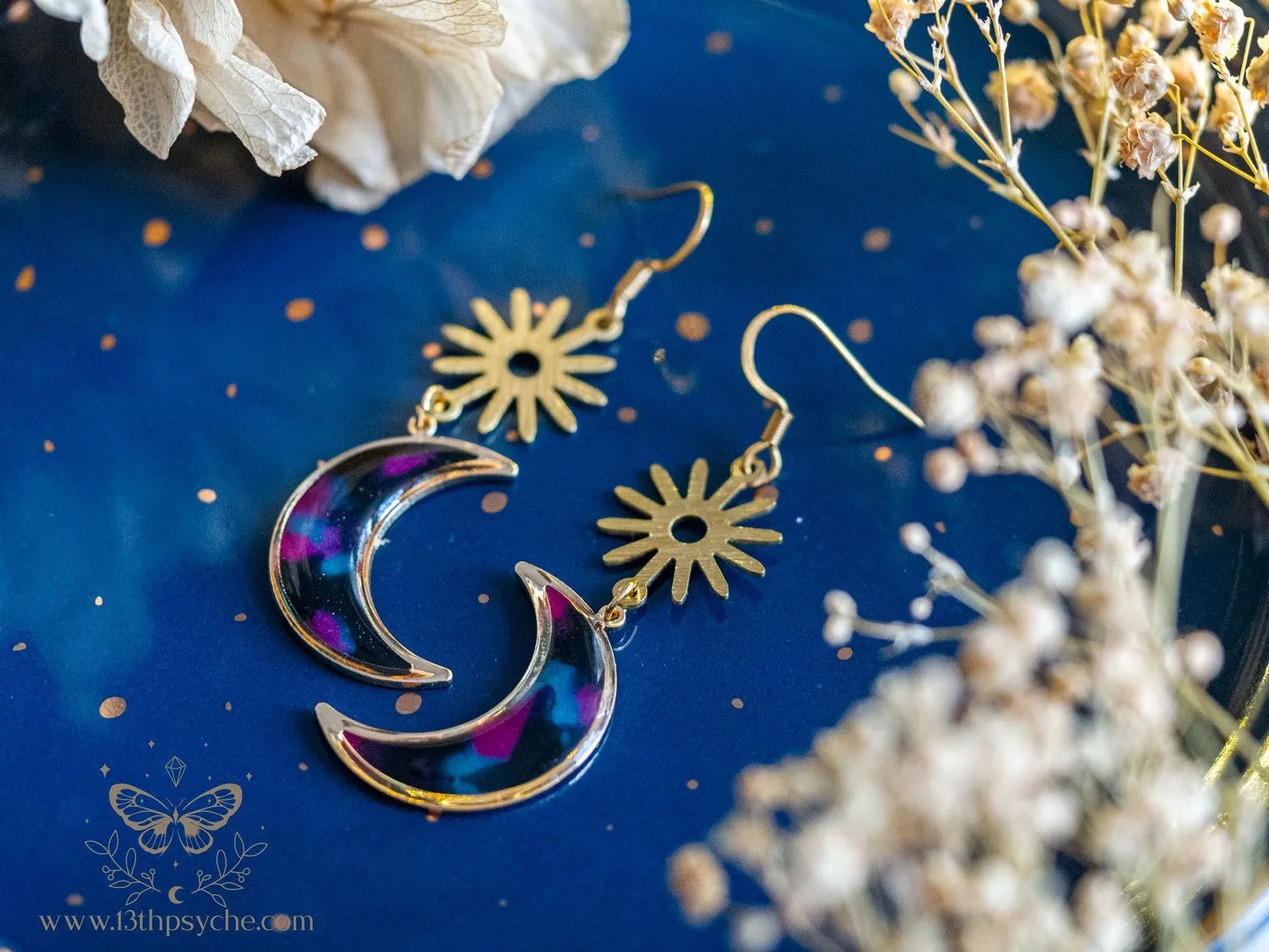 Spotted black dangle crescent moon earrings