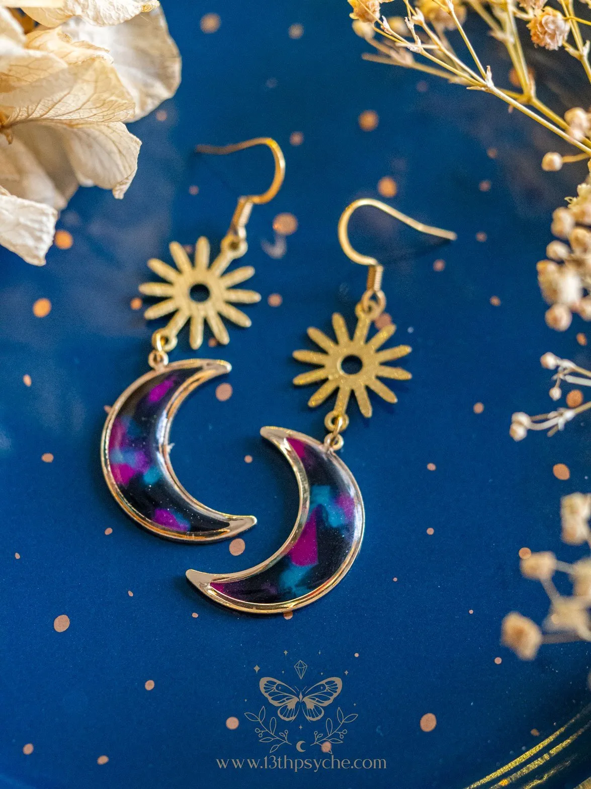 Spotted black dangle crescent moon earrings